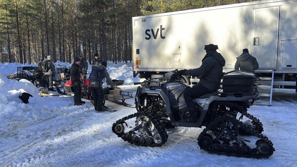 This undated photo, issued by SVT, shows preparations in Junsele, Sweden for the livestream 'The Great Moose Migration' to document the annual Moose migration near Kullberg in northern Sweden. (SVT via AP)