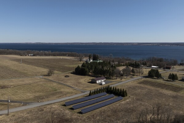 Solar panels operate at Fox Run Vineyards and Seneca Lake, Friday, March 21, 2025, in Penn Yan, N.Y. (Natasha Kaiser via AP)