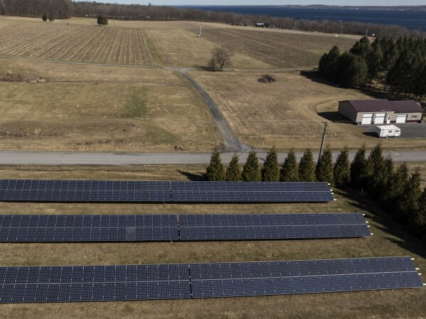 Solar panels operate at Fox Run Vineyards and Seneca Lake, Friday, March 21, 2025, in Penn Yan, N.Y. (Natasha Kaiser via AP)